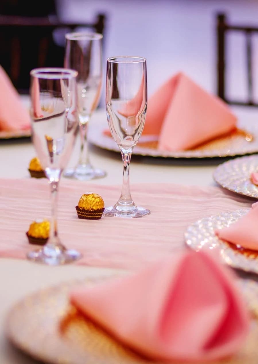 Close view of pink napkins and glassware