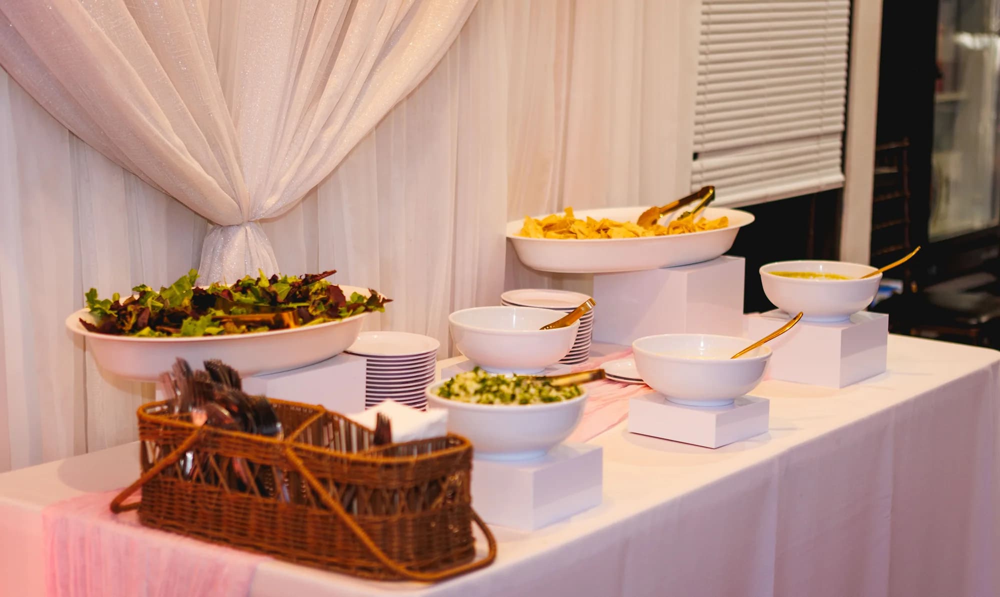 Food arranged on white tiered serving stands