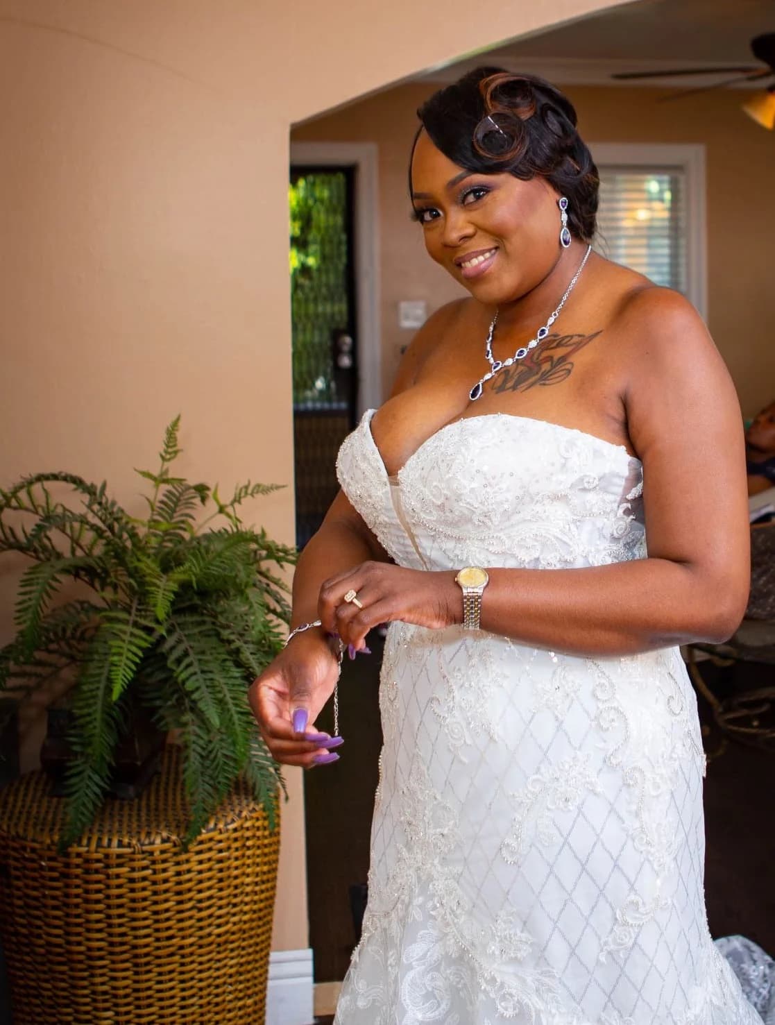 Bride in a lace gown holding her bouquet