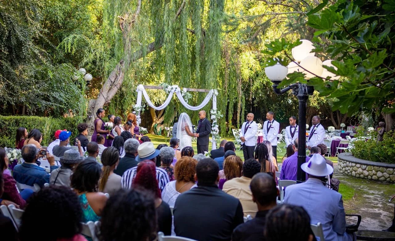 Wide view of the garden ceremony and seated guests