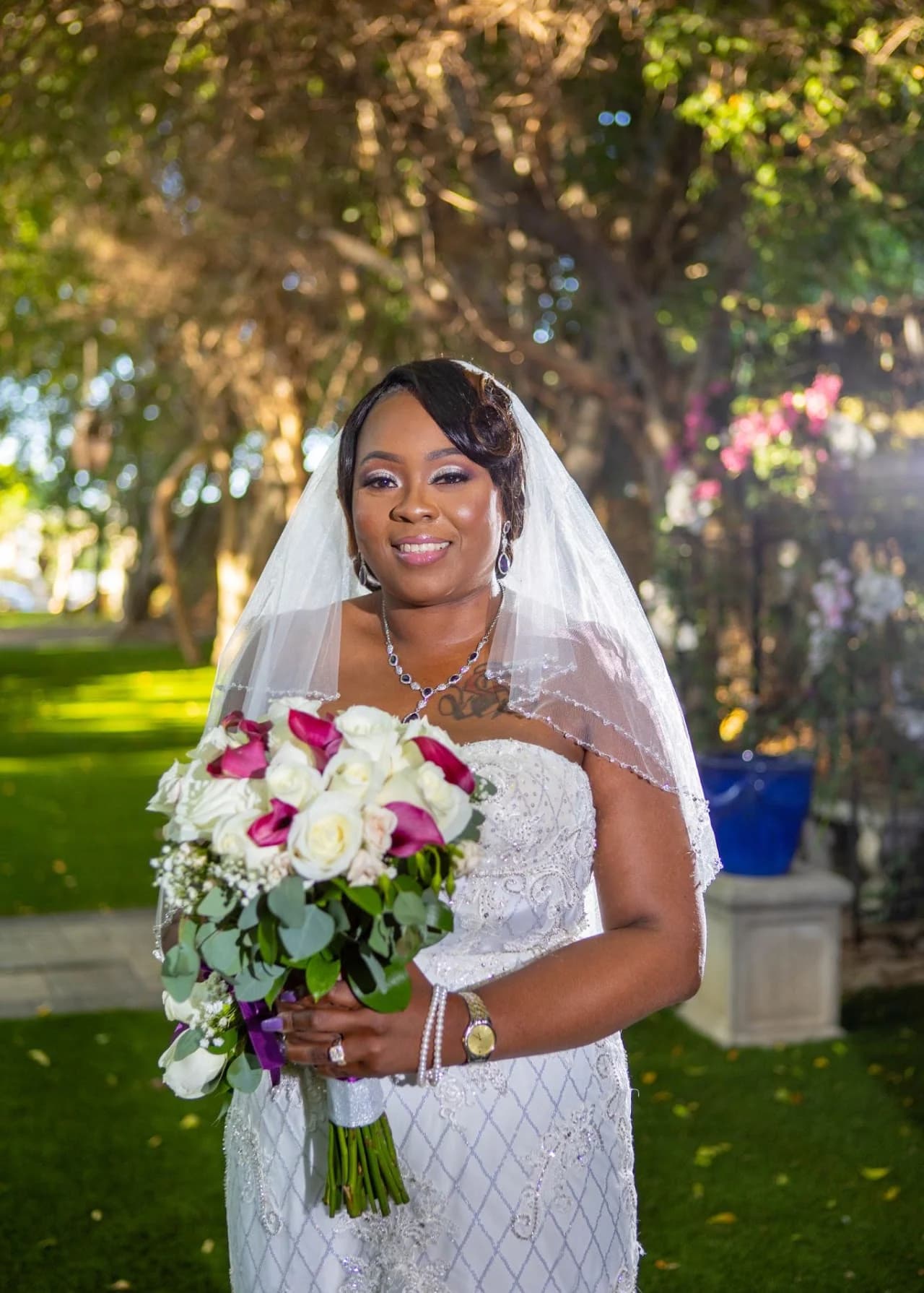 Bridal portrait with a bouquet beneath the trees