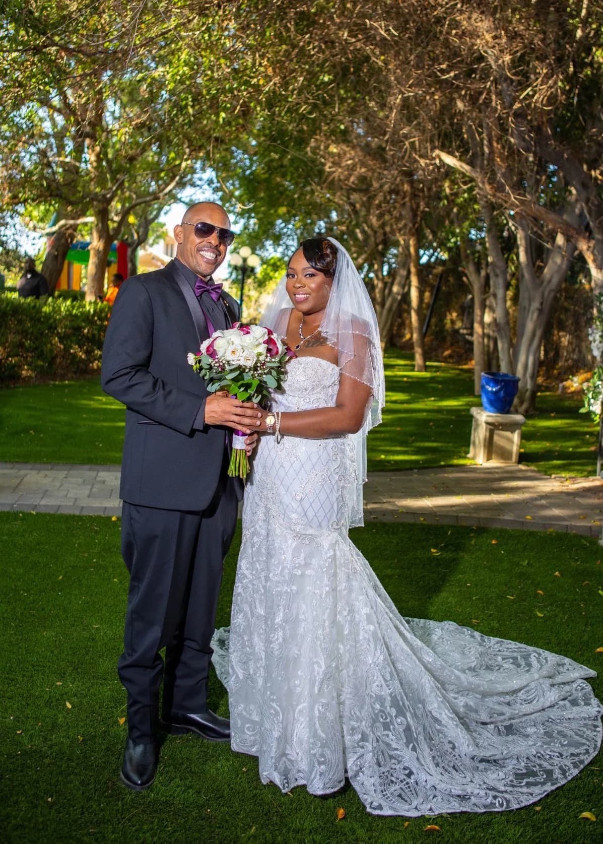 Couple standing together on a garden path
