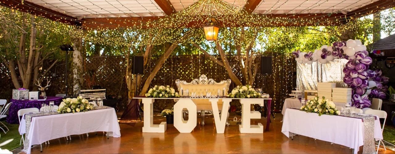 Reception canopy with flowers and illuminated LOVE letters