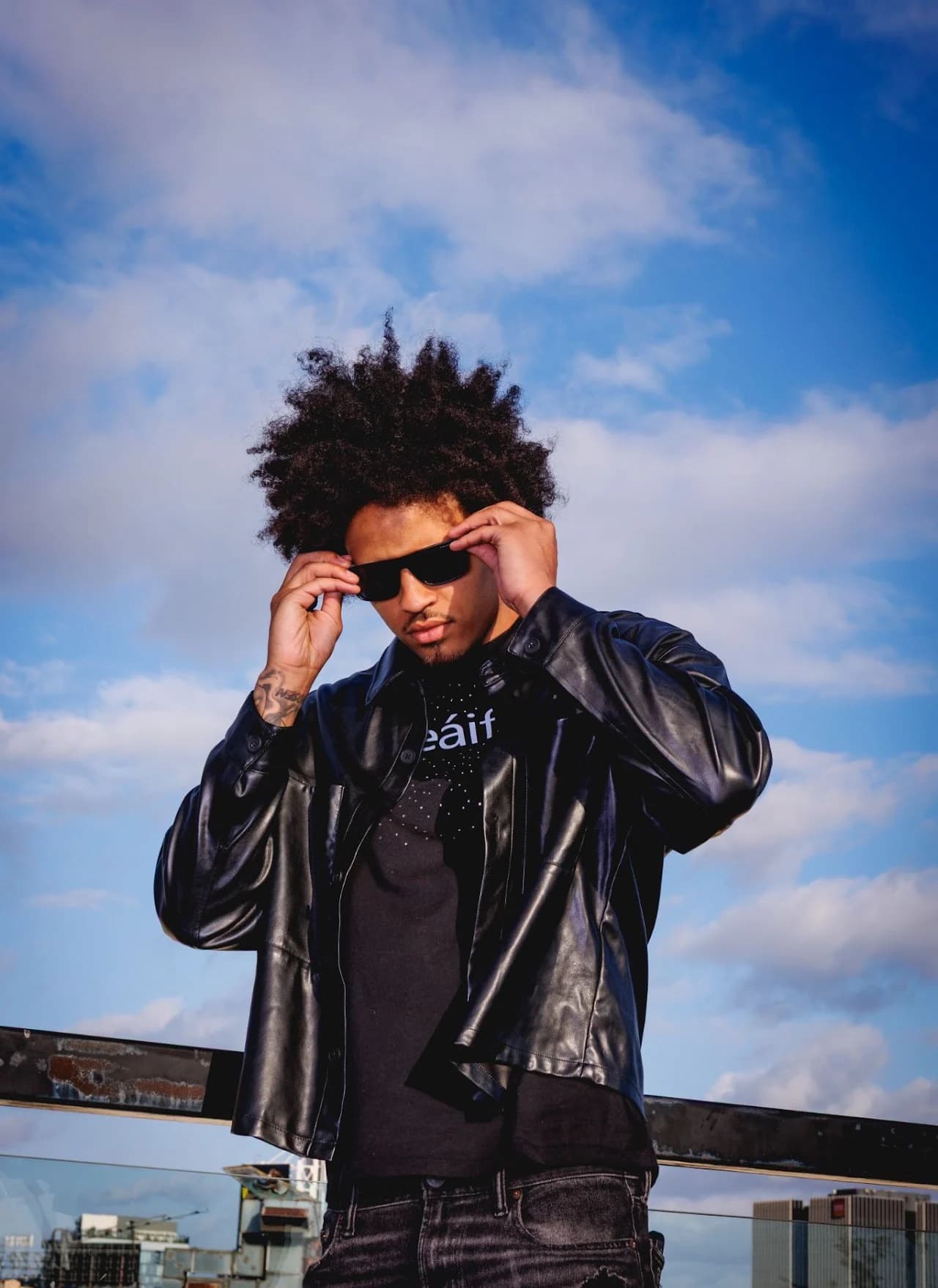 Portrait in a black jacket and sunglasses
