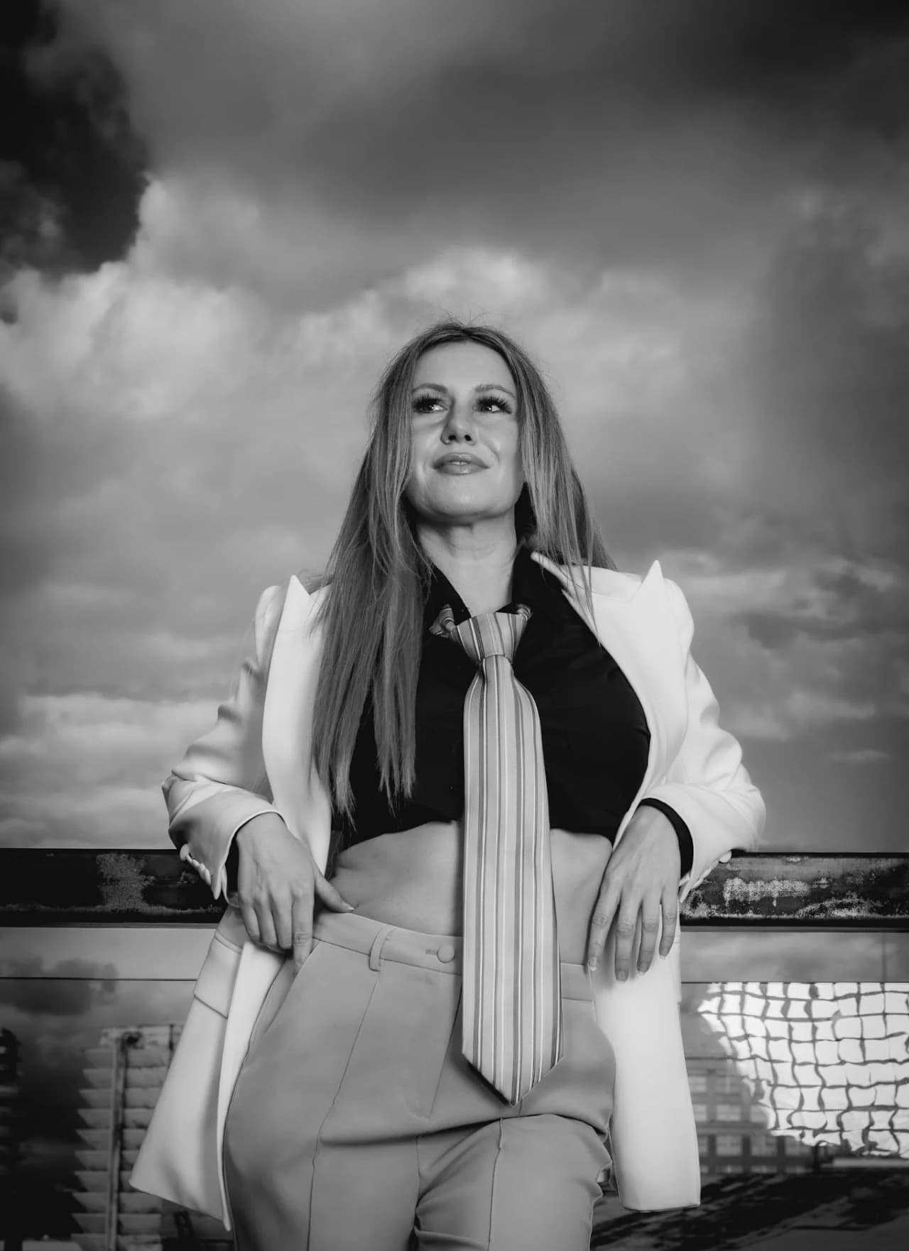Black-and-white portrait in a light suit
