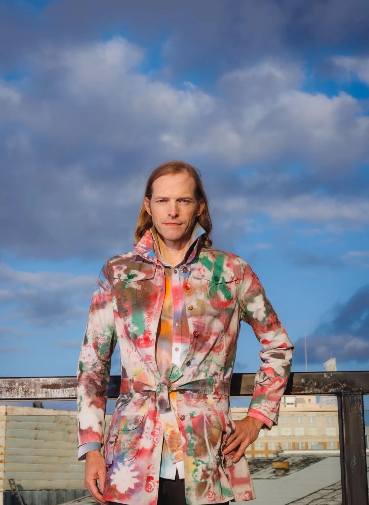 Full-length portrait in a patterned suit